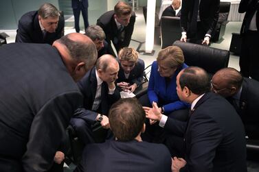 Egyptian President Abdel Fattah El Sisi, right, makes a point to Russian leader Vladimir Putin, centre, as German Chancellor Angela Merkel looks on during the Libya conference in Berlin January 19, 2020. EPA / SPUTNIK