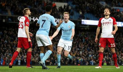 Manchester City's Kevin De Bruyne, right, celebrates with Raheem Sterling after scoring his side's second goal during the English Premier League soccer match Manchester City versus West Bromwich Albion at The Etihad Stadium, Manchester, England, Wednesday Jan. 31, 2018. (Martin Rickett/PA via AP)