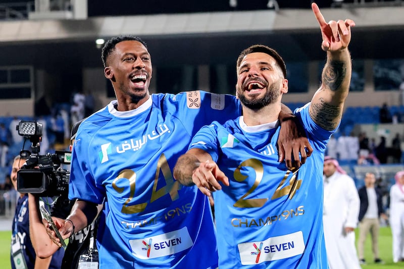 Alexander Mitrovic, right, scored twice in Al Hilal's  4-1 victory over Al Hazm at the Prince Faisal Bin Fahd Stadium in Riyadh on May 11, 2024. The win clinched Hilal a record-extending 19th Saudi Pro League title. AFP