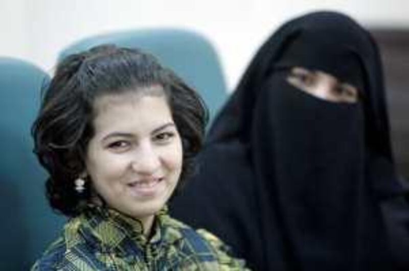 June 28, 2009 / Abu Dhabi / (Rich-Joseph Facun / The National) Anoud Mohamed Faraj (CQ), 13, left, sits with her mother Suhair Khalil (CQ), right, during a press conference at Sheikh Khalifa Medical City, Sunday, June 28, 2009 in Abu Dhabi. Faraj recently underwent a rare cardiac surgery after doctors discovered  a tumor in the right atrium of her heart.  *** Local Caption ***  rjf-0628-hearttumor005.jpg