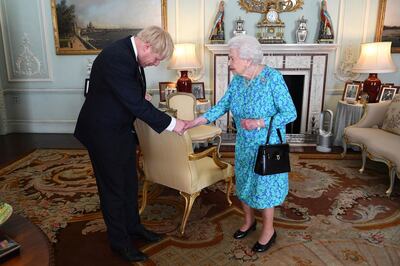 Britain's Queen Elizabeth II welcomes newly elected leader of the Conservative party Boris Johnson during an audience at Buckingham Palace, London, Wednesday July 24, 2019, where she invited him to become Prime Minister and form a new government. (Victoria Jones/Pool via AP)