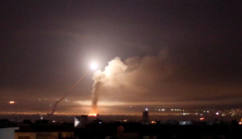 FILE PHOTO: Missile fire is seen from Damascus, Syria May 10, 2018. REUTERS/Omar Sanadiki/File Photo