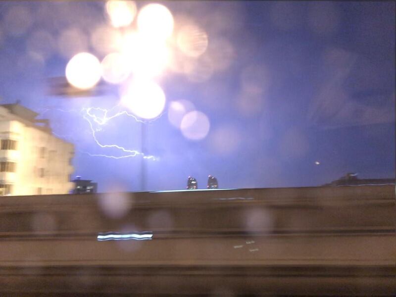 Lightning strikes over Abu Dhabi on Sunday. Charles Capel / The National