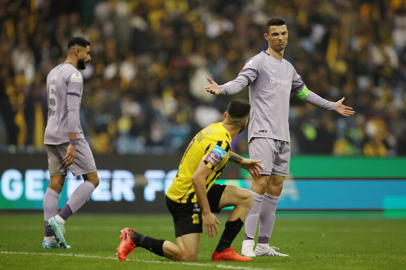 Cristiano Ronaldo of Al Nassr gestures towards an Al Ittihad player. Getty Images