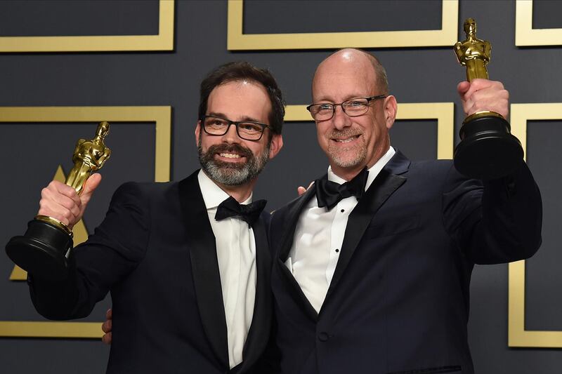 Andrew Buckland, left, and Michael McCusker, winners of the award for best film editing for "Ford v Ferrari", at the 92nd Academy Awards on Sunday, February 9. AP