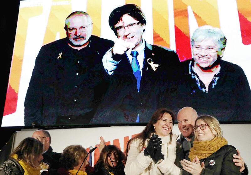 epa06399213 Former Catalonian regional President Carles Puigdemont (C, on screen) and former Catalonian regional ministers Clara Ponsati (R, on the screen) and Lluis Puig (L, on the screen) attend from Belgium, via videoconference, in the Catalonian pro-independence right party Junts per Catalunya's election campaign closing event in Barcelona, Catalonia, Spain, 19 December 2017. Junts per Catalunya is the party of ousted Catalonian regional President Carles Puigdemont (unseen), who stays in Belgium. Catalonian regional election will be held on 21 December.  EPA/Toni Albir