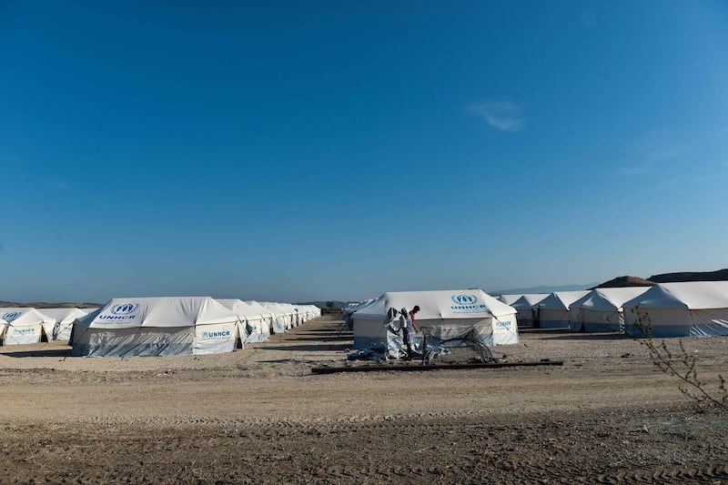 Migrants are seen at Nea Kavala camp, near the city of Kilkis, northern Greece.  Some 1000 refugees and migrants were transferred from the Greek island of Lesbos to the Nea Kavala camp under a decision taken by the Greek government at an emergency meeting on August 31.  AFP