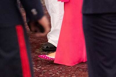 The shoes of first lady Melania Trump are seen at a state banquet at Rashtrapati Bhavan, Tuesday, Feb. 25, 2020, in New Delhi, India.  (AP Photo/Alex Brandon, Pool)