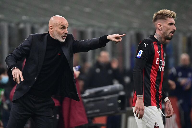 AC Milan coach Stefano Pioli gives instructions to Spanish forward Samuel Castillejo during the Italian Serie A football match against Udinese at the San Siro. AFP