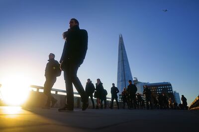 Commuters on London Bridge on Thursday. PA