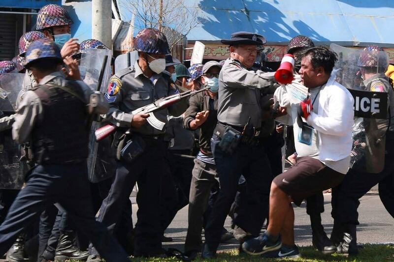 Police arrest a protester during a demonstration against the military coup in Mawlamyine in Mon State. AFP