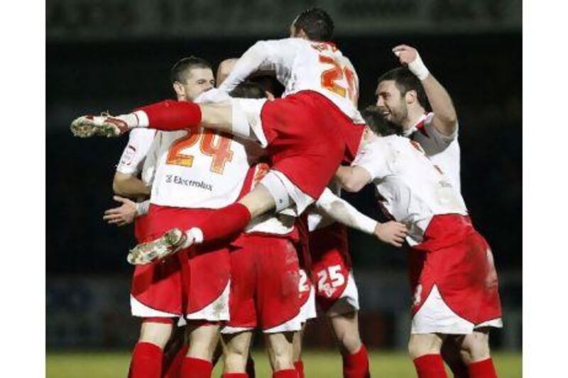 Stevenage players celebrate Stacy Long's goal. Darren Staples / Reuters