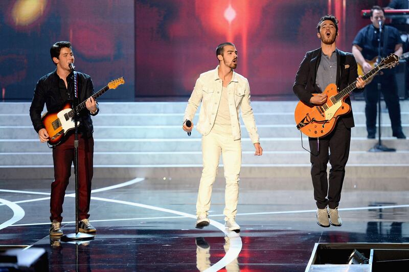 LAS VEGAS, NV - JUNE 16: Recording artists Nick Jonas, Joe Jonas and Kevin Jonas of the Jonas Brothers perform onstage during the 2013 Miss USA pageant at PH Live at Planet Hollywood Resort & Casino on June 16, 2013 in Las Vegas, Nevada.   Ethan Miller/Getty Images/AFP== FOR NEWSPAPERS, INTERNET, TELCOS & TELEVISION USE ONLY ==
 *** Local Caption ***  360021-01-09.jpg