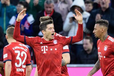 Bayern Munich's Polish striker Robert Lewandowski  celebrates after scoring during the German first division Bundesliga football match FC Bayern Munich v FSV Mainz 05 in Munich, southern Germany on March 17, 2019. Germany OUT / DFL REGULATIONS PROHIBIT ANY USE OF PHOTOGRAPHS AS IMAGE SEQUENCES AND/OR QUASI-VIDEO
 / AFP / dpa / Matthias Balk / DFL REGULATIONS PROHIBIT ANY USE OF PHOTOGRAPHS AS IMAGE SEQUENCES AND/OR QUASI-VIDEO
