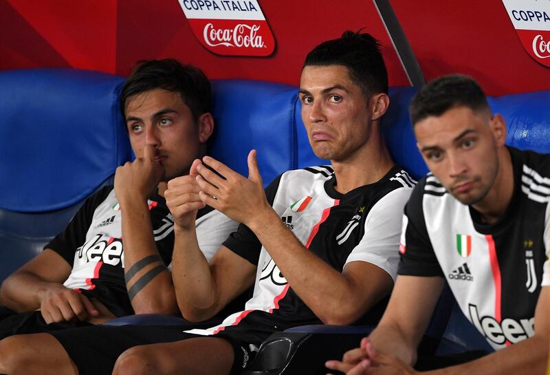 Cristiano Ronaldo and Paulo Dybala look dejected after the match. Reuters