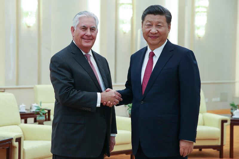 U.S. Secretary of State Rex Tillerson, left, shakes hands with China's President Xi Jinping before their meeting at the Great Hall of the People, Saturday, Sept. 30, 2017 in Beijing, China. (Lintao Zhang/Pool Photo via AP)