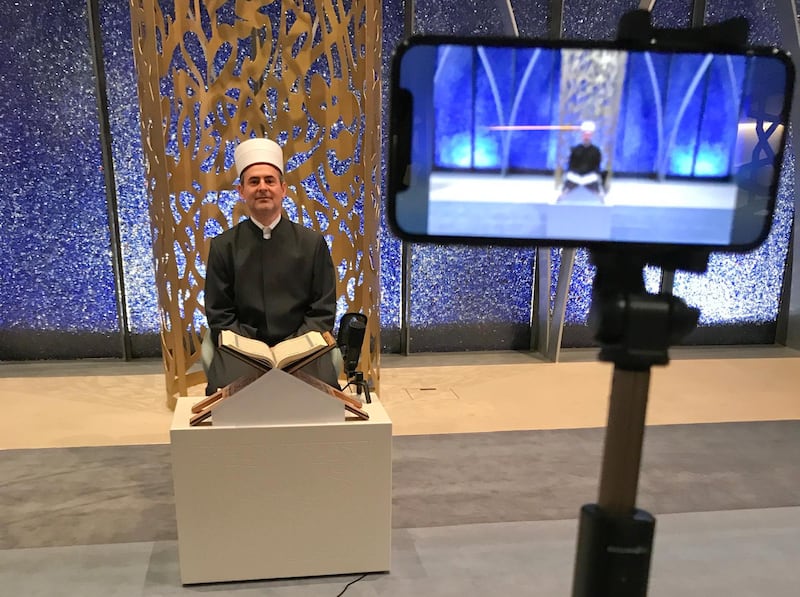 Imam Benjamin Idriz recites the Quran for a video message, on the first day of Ramadan in Penzberg, Germany. REUTERS