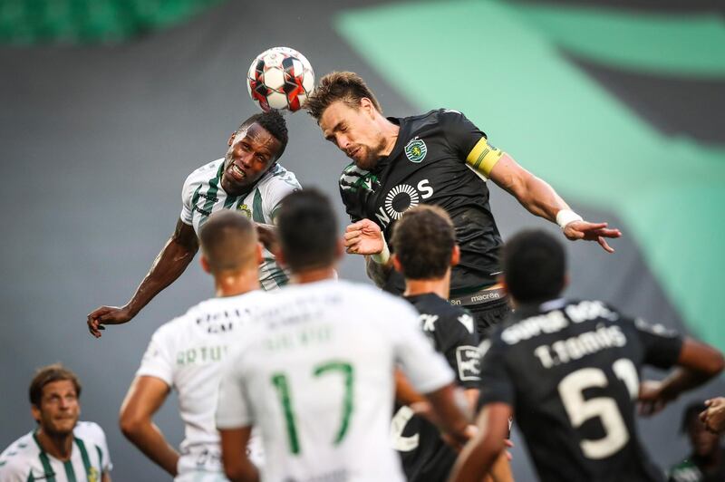 Sporting player Sebastian Coates, right, vies for the ball with Vitoria de Setubal player Semedo during the Portuguese First League match Sporting vs Vitoria de Setubal held at Alvalade Stadium, in Lisbon, Portugal. EPA