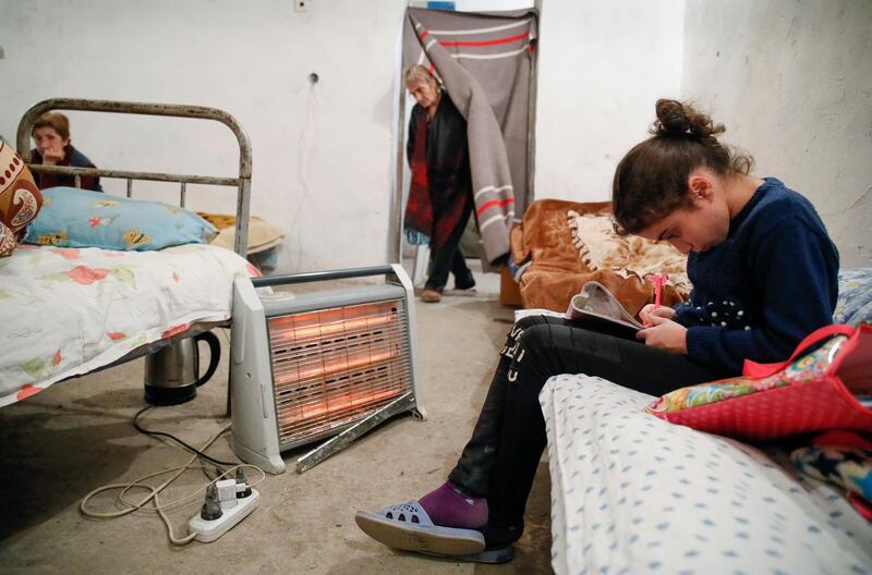People take refuge in a bomb shelter in Stepanakert, the separatist region of Nagorno-Karabakh. AP Photo