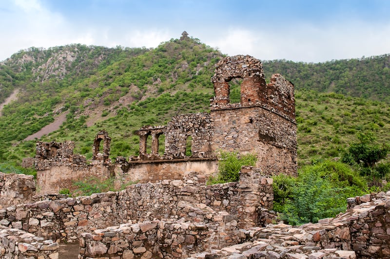 Ancient ruins are scattered across Bhangarh, on the edge of the Sariska Tiger Reserve in Rajasthan
