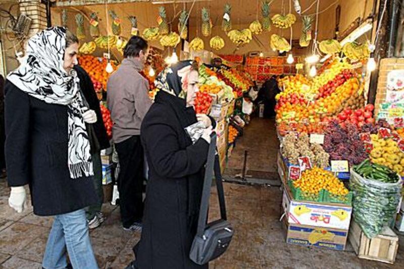 A bazaar in Tehran is laden with fruit, but as the western sanctions bite Iran may find international trade increasingly difficult.