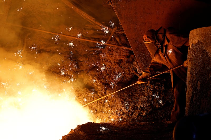 An employee carries out operations during the production of iron at the Yenakiyeve Iron and Steel Works during the Russia-Ukraine conflict in Yenakiyeve in the Donetsk region. Reuters