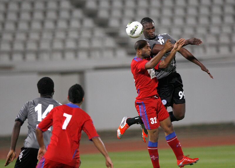 Al Ain, United Arab Emirates, Sept. 14 2012, Al Dhafra v Al Shaab- (blk kit) Al Dhafra's #99 makhete Diop misses aheader for Shaab . Al Shaab  and Dhafra will both move on into the pro league, Sept. 14, 2012 at Khalifa Bin Zayed Stadium. Mike Young / The National