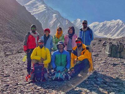 Zabih Afzali pictured front middle surrounded by friends at the base camp of Mount Noshakh, 2020. Courtesy Zabih Afzali