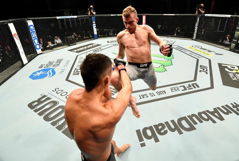 ABU DHABI, UNITED ARAB EMIRATES - JULY 12: (R-L) Davey Grant of England launches a flying knee against Martin Day in their bantamweight fight during the UFC 251 event at Flash Forum on UFC Fight Island on July 12, 2020 on Yas Island, Abu Dhabi, United Arab Emirates. (Photo by Jeff Bottari/Zuffa LLC)