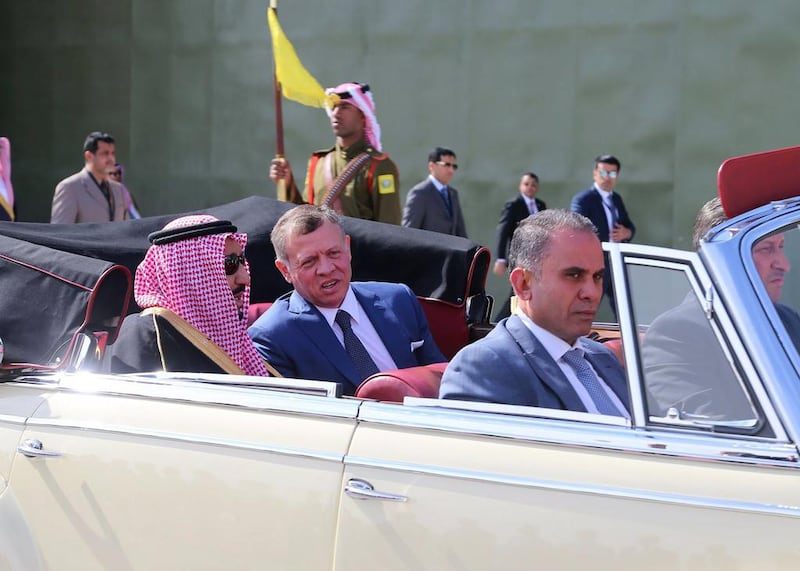 Jordan's King Abdullah II talks to Saudi Arabia's King Salman in the back of a car at Amman's Marka military airport on March 27, 2017. Yousef Allan / EPA / Handout