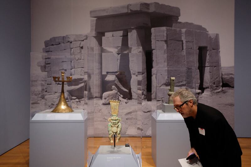 A visitor views the objects on display at the exhibition