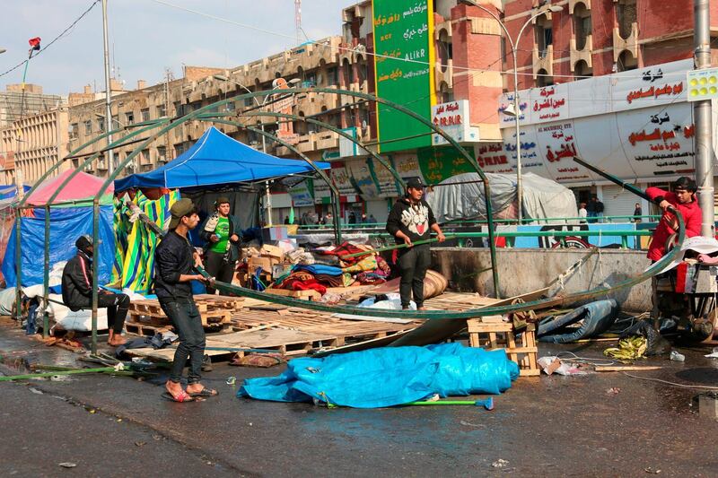 Followers of Shiite cleric Moqtada Al Sadr dismantle their tents in preparation for withdrawing from the anti-government protests in Tahrir Square in Baghdad. AP Photo