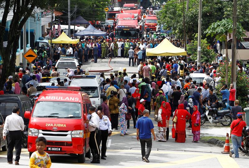 Religious school Darul Quran Ittifaqiyah is cordoned off after a fire broke out in Kuala Lumpur, Malaysia. Lai Seng Sin / Reuters