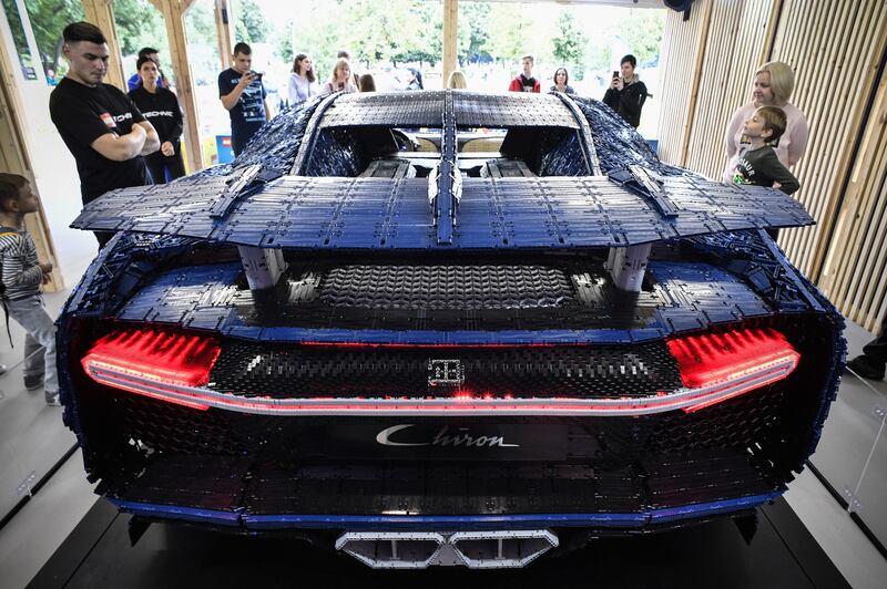 Visitors inspect a driveable, full-size Bugatti Chiron car made made from Lego Technic blocks at an exhibition in Moscow's Gorky Park. The model, built using more than a million pieces, weighs 1,500 kilograms and has a top speed of 20ph. Lego specialists spent 13.438 hours engineering and assembling the model without using a single drop of glue. AFP