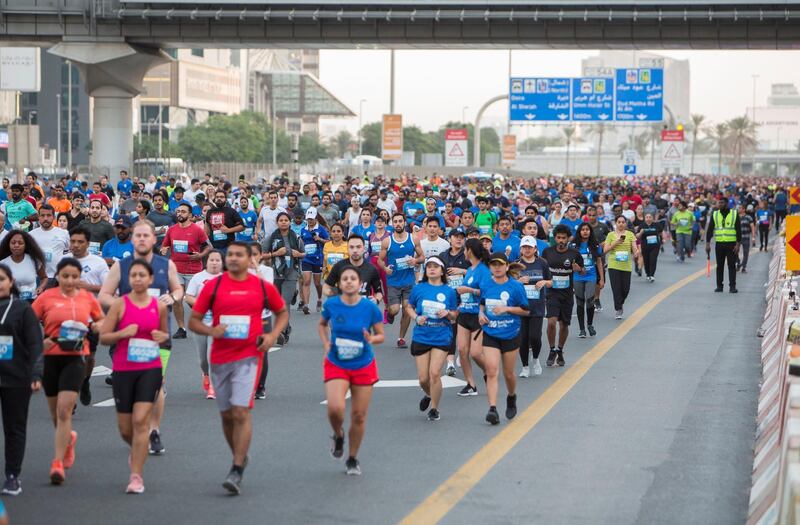 Dubai, United Arab Emirates - Participants from all walks of life running at the Dubai 30x30 Run at Sheikh Zayed Road.  Leslie Pableo for The National