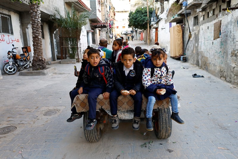Children are taken to school in Khan Younis, southern Gaza.