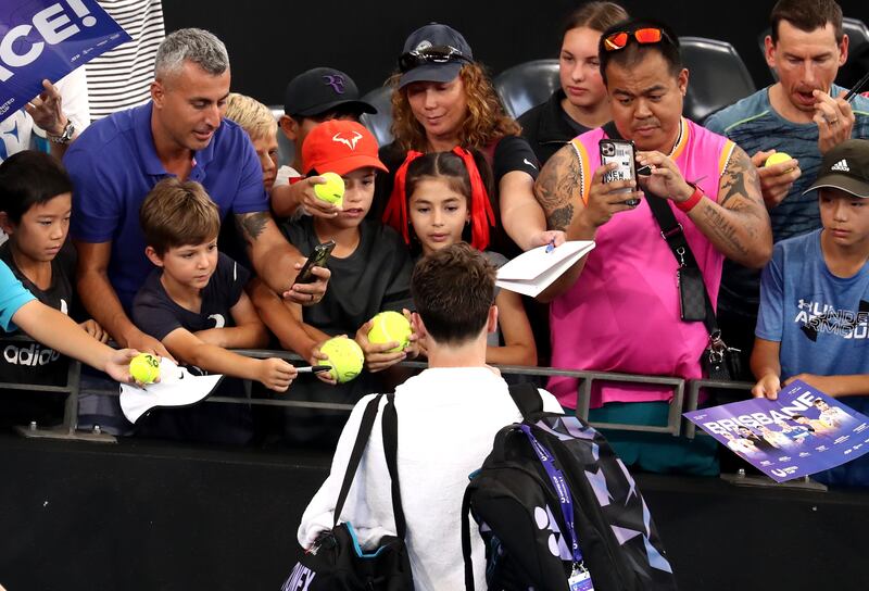 Casper Ruud of Norway signs autographs after beating Thiago Monteiro of Brazil in the 2023 United Cup tennis match between Brazil and Norway in Brisbane, Australia. EPA