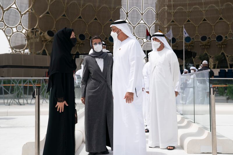 HH Sheikh Mohamed bin Zayed Al Nahyan Crown Prince of Abu Dhabi Deputy Supreme Commander of the UAE Armed Forces (R), speaks HE Reem Al Hashimi, UAE Minister of State for International Cooperation and Director General of EXPO 2020 Dubai (L) and HE Noura Al Kaabi, Minister of Culture and Youth, Commissioner - General of the UAE Pavilion at Expo 2020 (C), during a visit to EXPO 2020 Dubai. Ryan Carter for the Ministry of Presidential Affairs
---