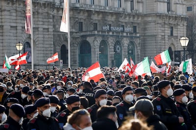 Police officers on guard as demonstrators gather to protest against the coronavirus lockdown measures in Vienna. Reuters