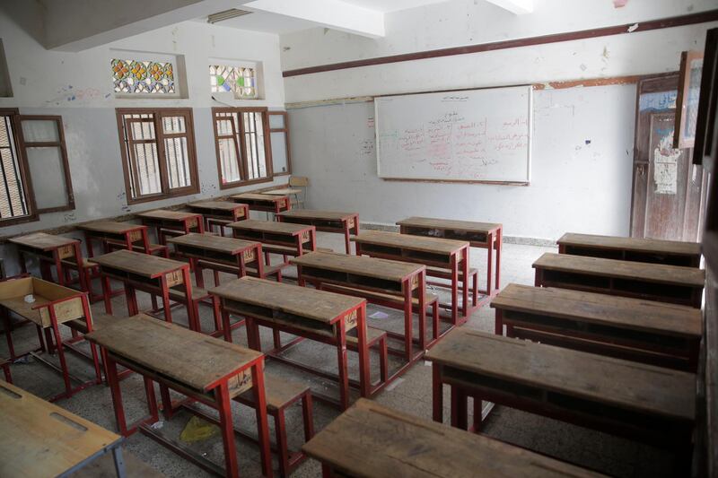 An empty classroom is seen at a closed school in Sanaa, Yemen, Sunday, March 15, 2020. The Houthi rebels, who control the capital, Sanaa, and the country's north announced the closure of classes in areas under their control for a month as part of a preventive measure taken against the spread of the new coronavirus. (AP Photo/Hani Mohammed)
