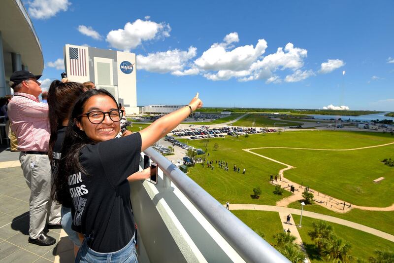 Al Mansoori watches a SpaceX Falcon 9 rocket launch from Kennedy Space Center carrying her Genes in Space experiment to the International Space Station on Aug. 14, 2017 in {town}, Florida. 
(Scott A. Miller for The National)