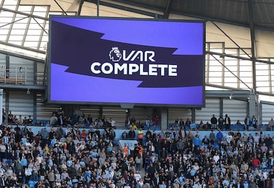 Fans wait while a possible goal by Manchester City's Gabriel Jesus is checked by VAR during the English Premier League soccer match between Manchester City and Tottenham Hotspur at Etihad stadium in Manchester, England. AP Photo