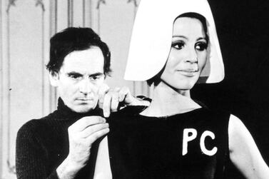 An archive image of Pierre Cardin adjusting one of his designs. Courtesy Pierre Cardin Museum