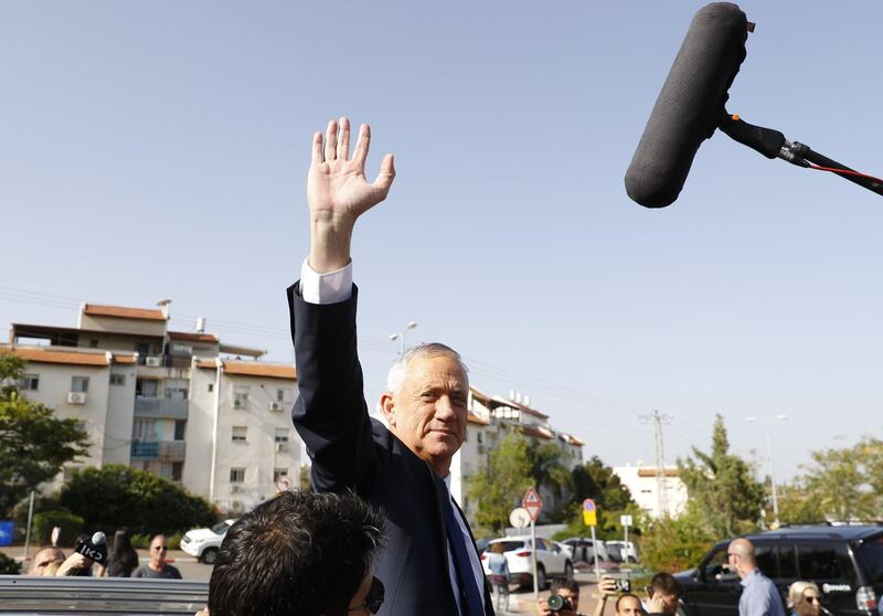 Retired Israeli general Benny Gantz, one of the leaders of the Blue and White political alliance, waves after casting his vote during Israel's parliamentary elections. AFP