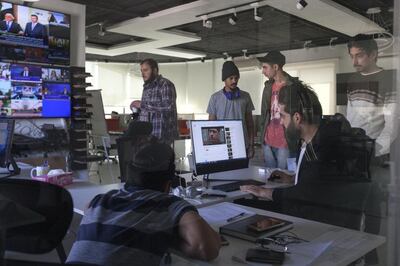 Ahmed Al Basheer, 32, works on May 08, 2017, with the research team of the Al Basheer Show, at the research desk of the company, in Amman, Jordan. The research team daily work consists of screening dozens of Iraqi TV channels to spot important and original news. An Iraqi comedy broadcast on YouTube and Deutsche Welle (DW), the Al Basheer Show is a satirical and entertaining look politics and daily life in Iraq using comedy sketches and humorous songs. Today Al Basheer Show is one of the most successful comic productions of the Arab world. Relocated in the Jordanian capital since 2012 to regain the freedom to criticize political power that does not hesitate to persecute and imprison critics, Ahmed Al Basheer is fighting for a liberal Iraq, without terror or violence, where different faiths - Christians, Kurds Sunni and Shi'ite - could live in plurality. Forever marked by a suicide attack on February 24th, 2011, in the heart of his hometown of Ramadi, 100 km from Baghdad, where he was spared but which cost the lives of seven of his colleagues, neighbors and friends, Ahmed Al Basheer vowed to engage in a battle against obscurantism, using the sharp edge of humor, biting parody and media power.