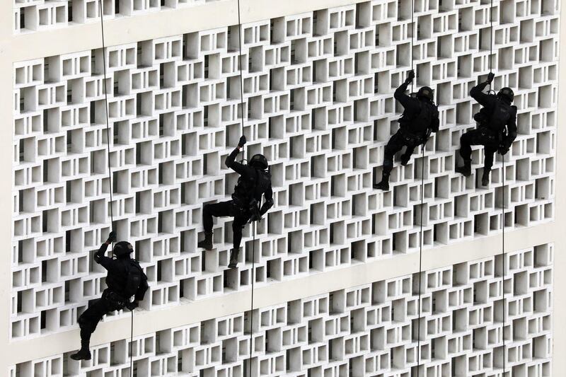 Members of the Sri Lanka Army Special Forces Regiment participate in a mock rescue and raid operation during the ongoing 'Ex Cormorant Strike X 2019' in Colombo, Sri Lanka. EPA