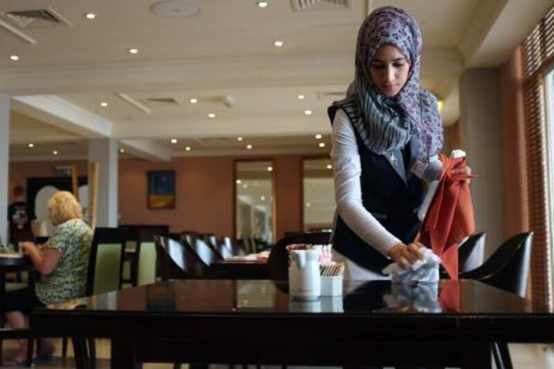 MUSCAT, OMAN -  July 3, 2011 - Pics from Oman to go with Comment column by Rym. This is a photo of Omani student doing an internship at a local Muscat hotel.  ( DELORES JOHNSON / The National 