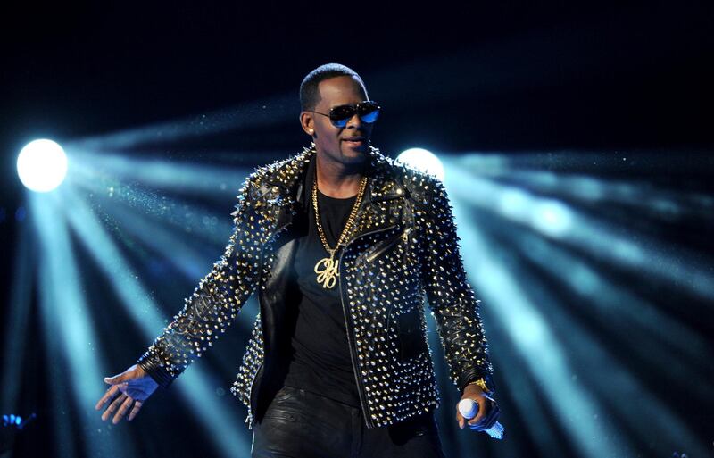 FILE - In this June 30, 2013 file photo, R. Kelly performs at the BET Awards at the Nokia Theatre in Los Angeles. R. Kelly is announcing a new tour, but it won't be in the United States. The embattled entertainer announced on social media Tuesday, Feb. 5, 2019, that he'll be going to Australia, New Zealand and Sri Lanka.  (Photo by Frank Micelotta/Invision/AP, File)