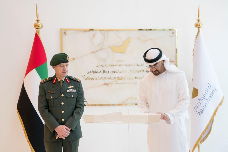 ABU DHABI, UNITED ARAB EMIRATES - September 20, 2017: HH Sheikh Mohamed bin Zayed Al Nahyan Crown Prince of Abu Dhabi Deputy Supreme Commander of the UAE Armed Forces (R), signs a guest book during the inauguration of the Rabdan Academy. Seen with Major General Mike Hindmarsh, Chairman of the Board of Trustees of the Rabdan Academy (L).

( Rashed Al Mansoori / Crown Prince Court - Abu Dhabi )
---