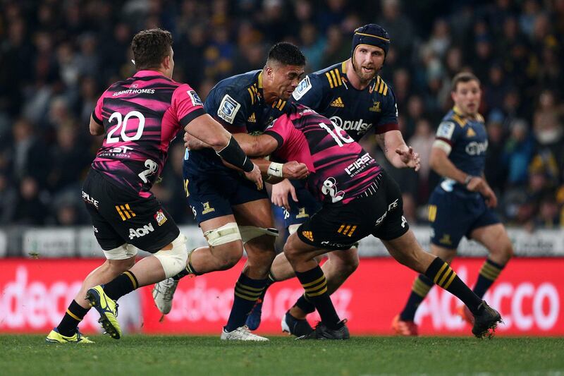 Marino Mikaele Tu'u of the Highlanders is tackled by Bradley Slater of the Chiefs during the Super Rugby match in Dunedin. Getty